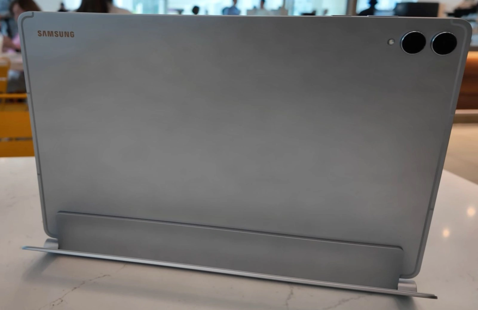 Back of the Samsung Galaxy Tab S11 Ultra showing the aluminium unibody, dual camera bar and S Pen magnetic strip