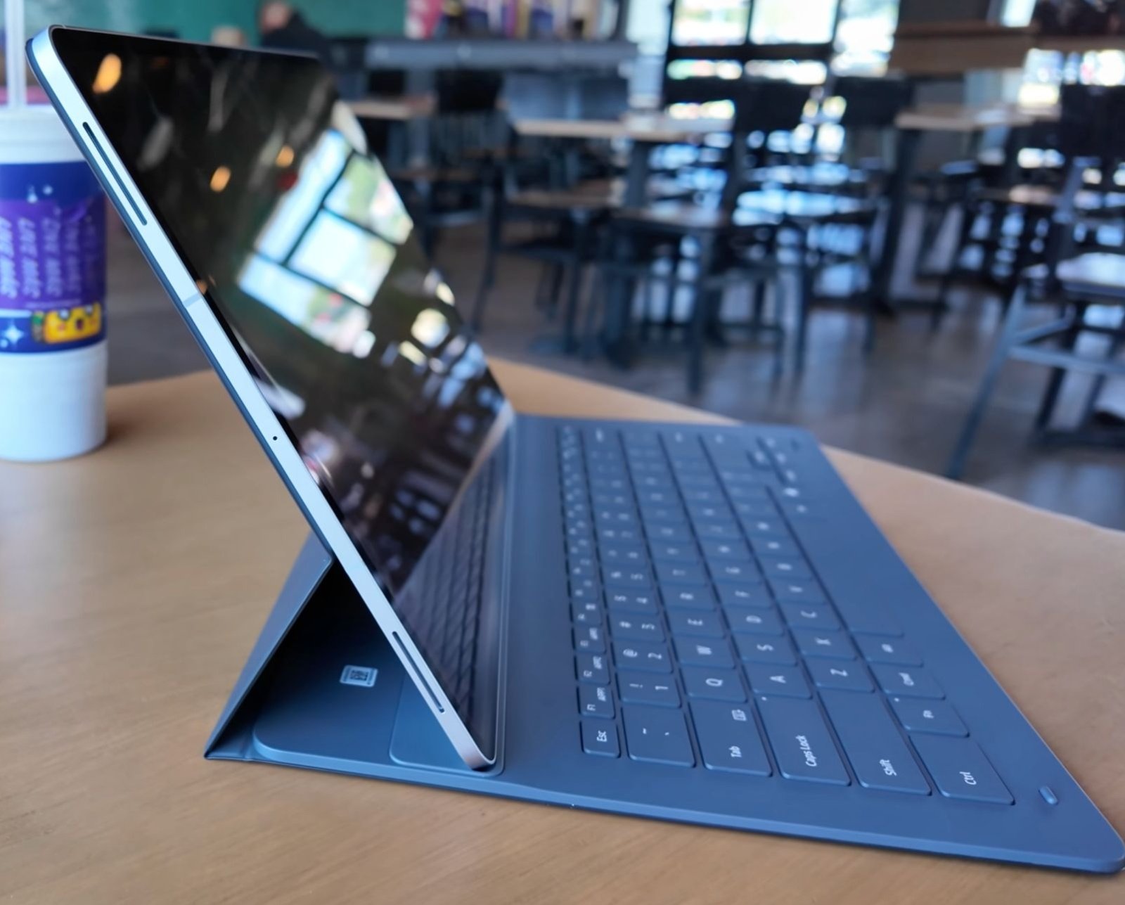 Samsung Galaxy Tab S11 Ultra side view with the Book Cover Keyboard attached, propped up like a laptop